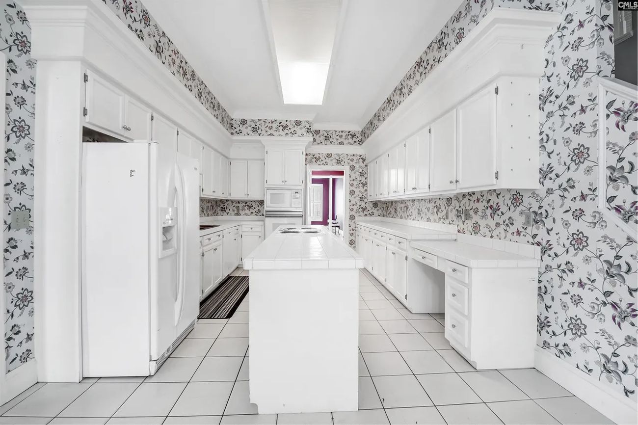 Original galley kitchen looking straight down the room