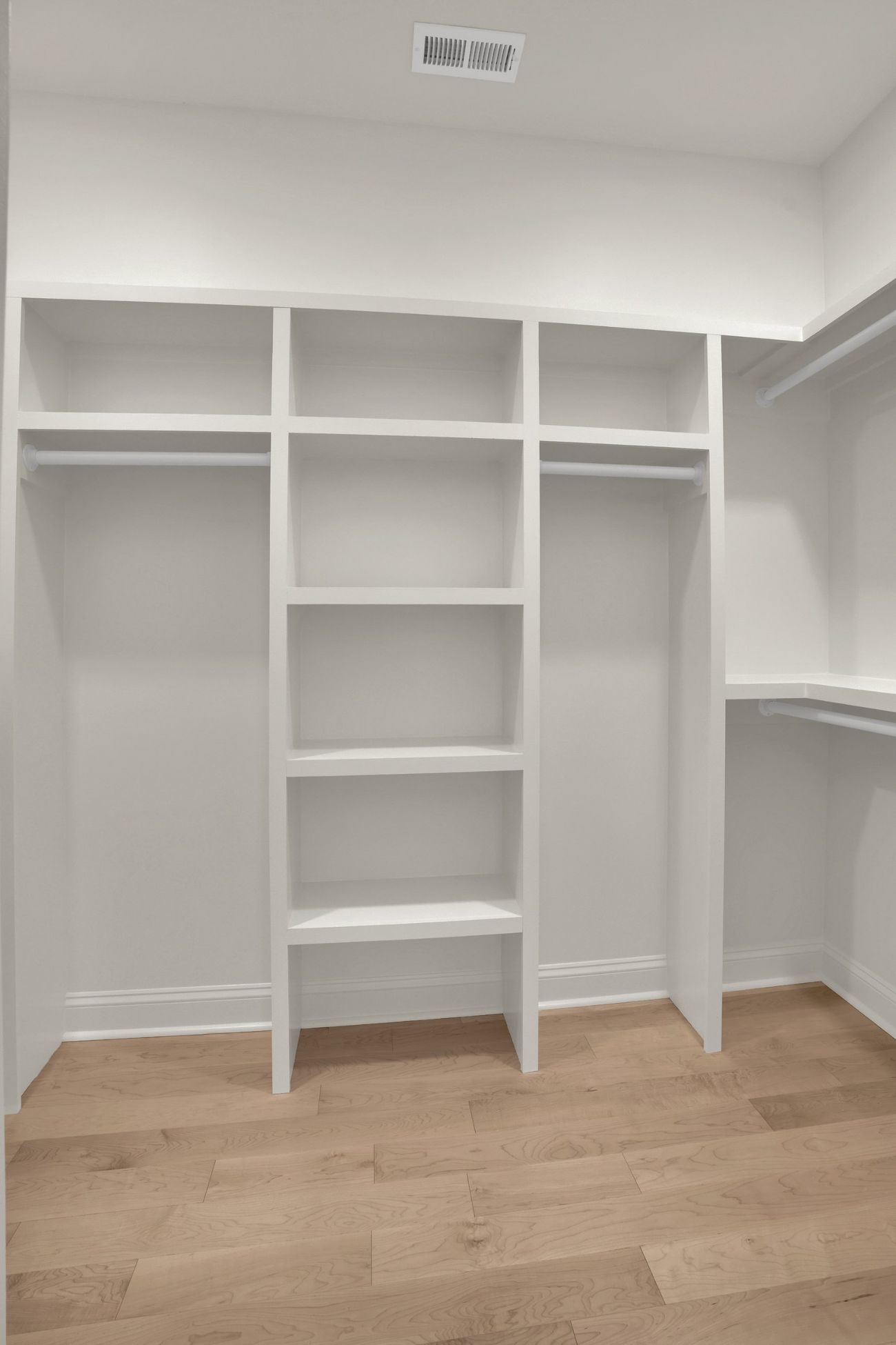 Fitted closet with built-in shelving and hanging
